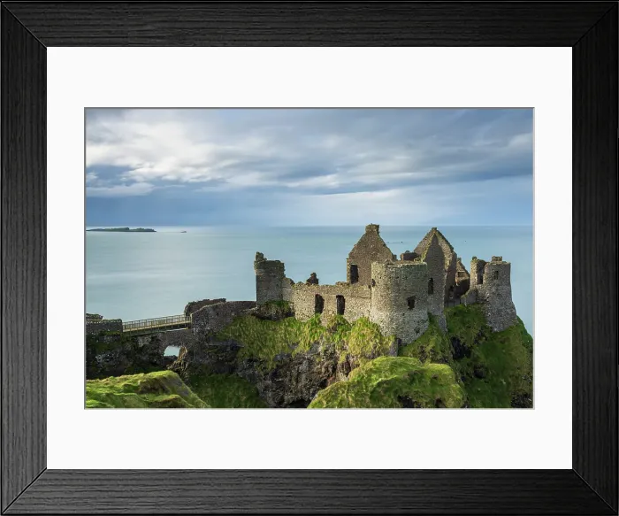 Framed Print : Dunluce Castle perched on the clifftops of the Causeway Coast, County Antrim, Northern Ireland. Spring (March) 2024