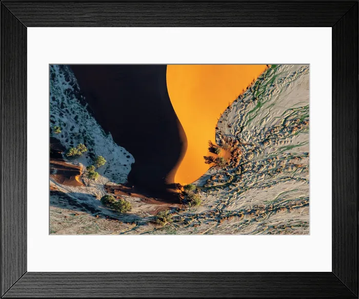 Framed Print : Aerial view of the snaking ridge of a golden sand dune, Sossusvlei, Namib-Naukluft National Park, Namib Desert, Namibia Framed Print : Aerial view of the snaking ridge of a golden sand dune, Sossusvlei, Namib-Naukluft National Park, Namib Desert, Namibia