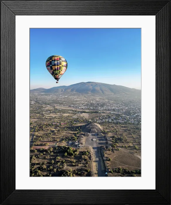 Framed Print : Hot air balloon flying over the Avenue of the Dead and the Pyramid of the Moon at sunrise, aerial view, Teotihuacan, Mexico State, Mexico Framed Print : Hot air balloon flying over the Avenue of the Dead and the Pyramid of the Moon at sunrise, aerial view, Teotihuacan, Mexico State, Mexico