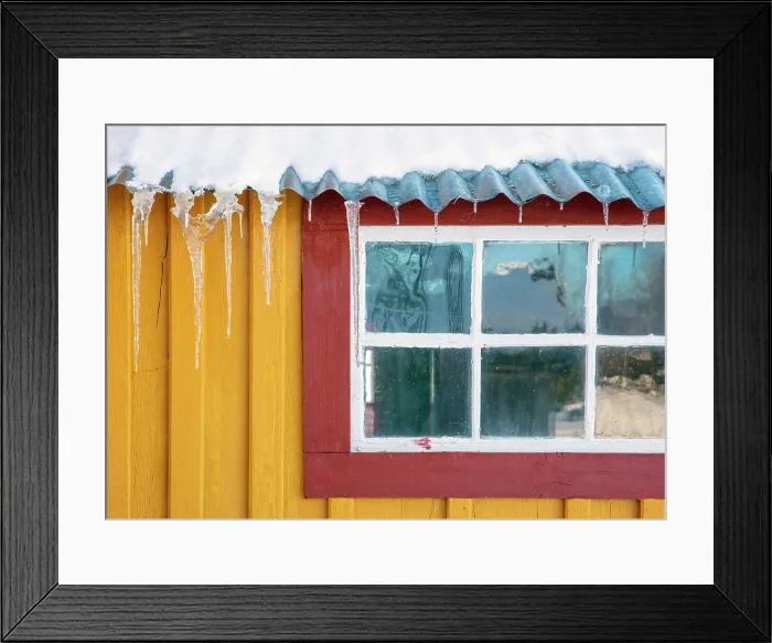 Framed Print : Yellow wall and red windowframe of old wooden house in the snow, Straumen Farm, Straumsbukta, Kvaloya, near Tromso, Norway