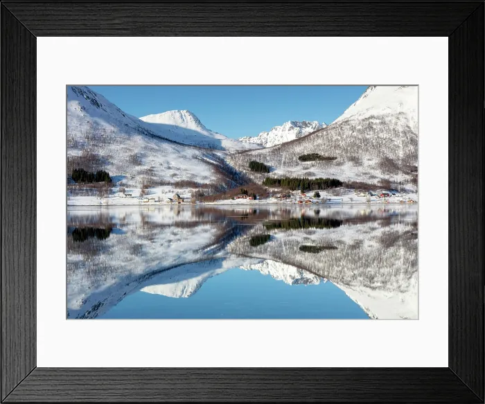 Framed Print : Snow-covered mountains with a perfect reflection in flat calm waters of Sorfjorden, island of Kvaloya, near Tromso, Norway