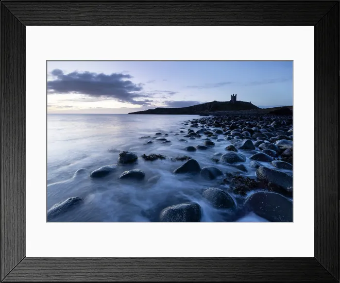 Framed Print : Dunstanburgh Castle ruins and beach of basalt boulders near Embleton, Northumberland, England Framed Print : Dunstanburgh Castle ruins and beach of basalt boulders near Embleton, Northumberland, England