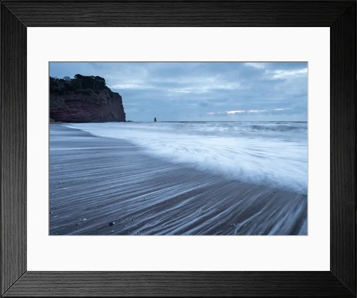Framed Print : Stormy sunrise on Holcombe Beach in Teignmouth, Devon, England. Winter (February) 2025