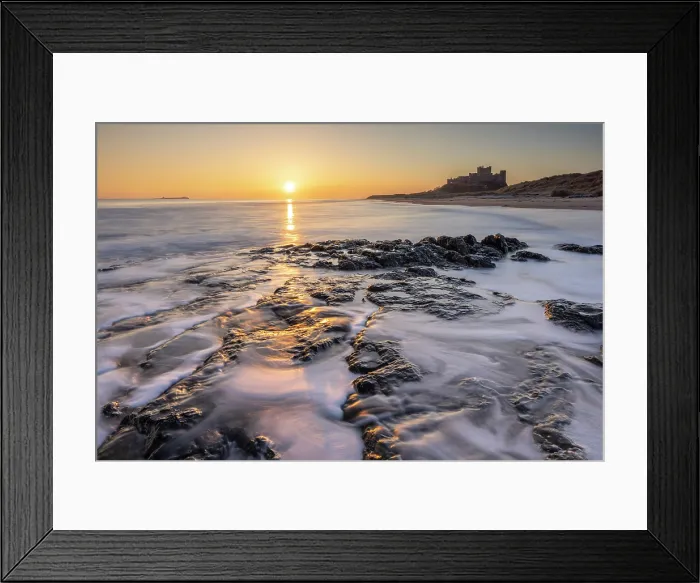 Framed Print : Sunrise over Bamburgh Castle and beach, Northumberland, England. Winter (March) 2025 Framed Print : Sunrise over Bamburgh Castle and beach, Northumberland, England. Winter (March) 2025