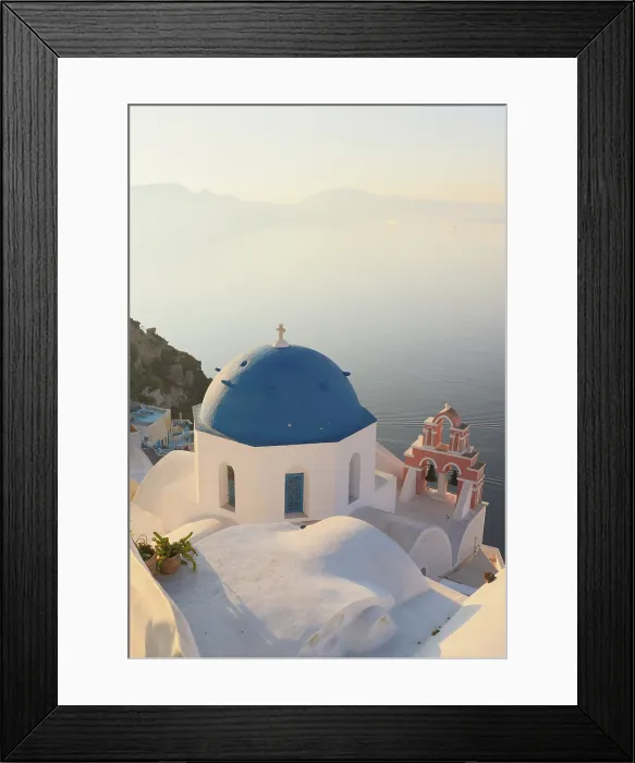 Framed Print : Blue domed churches, white-washed houses and steps with caldera view in the distance, Oia, Santorini, Cyclades Islands, Greece Framed Print : Blue domed churches, white-washed houses and steps with caldera view in the distance, Oia, Santorini, Cyclades Islands, Greece