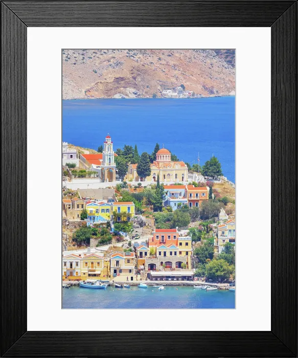 Framed Print : Colourful houses and Evangelismos church at the Harani Bay, Gialos, Symi Island, Dodecanese Islands, Greece Framed Print : Colourful houses and Evangelismos church at the Harani Bay, Gialos, Symi Island, Dodecanese Islands, Greece
