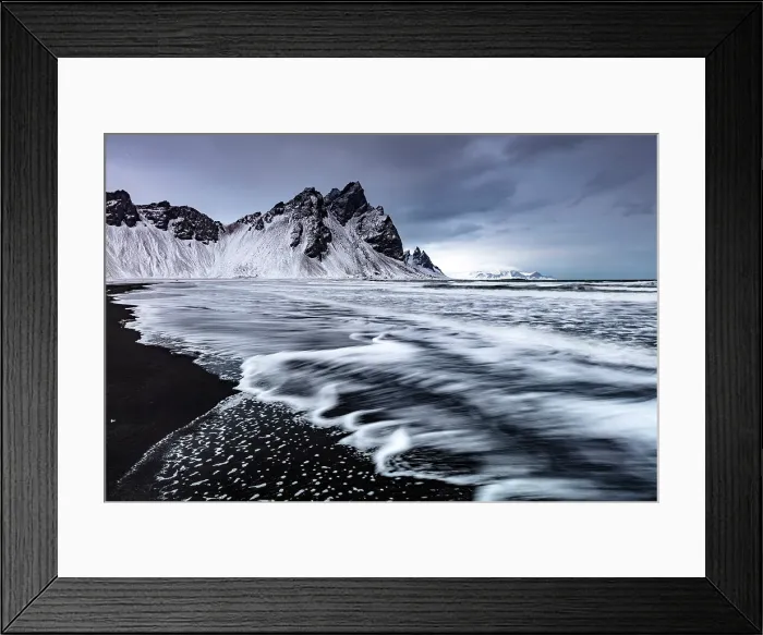 Framed Print : Vestrahorn mountain in winter, with waves washing up the black sand beach. Stokksnes, Southeast Iceland