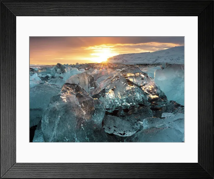 Framed Print : Black volcanic sand beach covered in icebergs from Jokulsarlon glacier lagoon at sunset, Southeast Iceland Framed Print : Black volcanic sand beach covered in icebergs from Jokulsarlon glacier lagoon at sunset, Southeast Iceland
