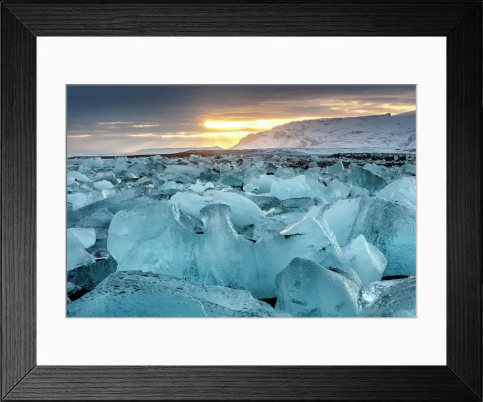Framed Print : Black volcanic sand beach covered in icebergs from Jokulsarlon glacier lagoon at sunset, Southeast Iceland Framed Print : Black volcanic sand beach covered in icebergs from Jokulsarlon glacier lagoon at sunset, Southeast Iceland