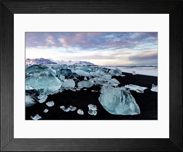 Framed Print : Black volcanic sand beach covered in icebergs from Jokulsarlon glacier lagoon, at dawn, Southeast Iceland Framed Print : Black volcanic sand beach covered in icebergs from Jokulsarlon glacier lagoon, at dawn, Southeast Iceland