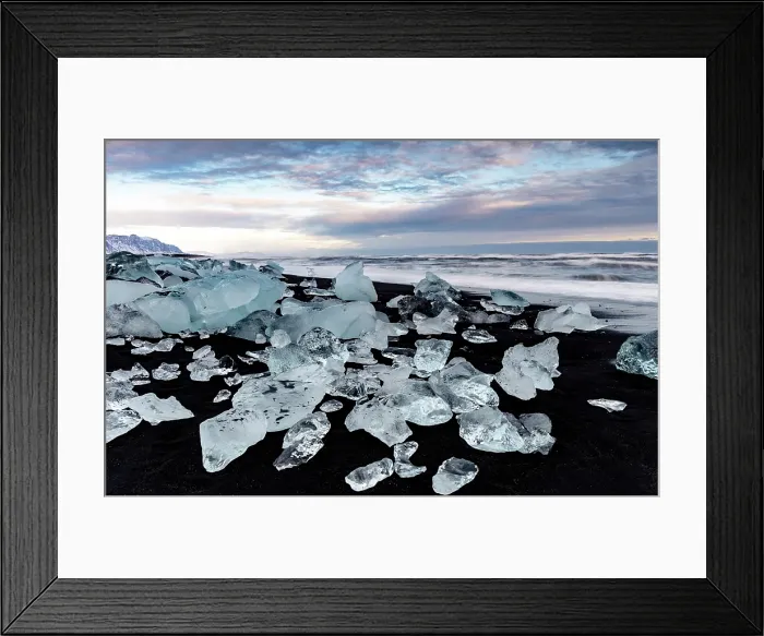 Framed Print : Black volcanic sand beach covered in icebergs from Jokulsarlon glacier lagoon, at dawn, Southeast Iceland Framed Print : Black volcanic sand beach covered in icebergs from Jokulsarlon glacier lagoon, at dawn, Southeast Iceland