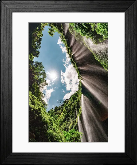 Framed Print : Low angle view of water cascades down the lush towering walls of Madakaripura waterfall, Bromo, East Java, Indonesia Framed Print : Low angle view of water cascades down the lush towering walls of Madakaripura waterfall, Bromo, East Java, Indonesia