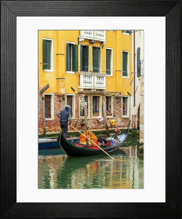 Framed Print : Gondolier and gondola boat in a small water canal, Venice, Veneto, Italy Framed Print : Gondolier and gondola boat in a small water canal, Venice, Veneto, Italy