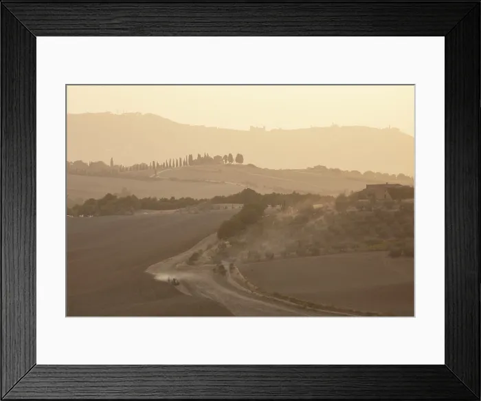 Framed Print : Hazy landscape at dusk, with tractor ploughing field, Val d'Orcia, near Pienza, Tuscany, Italy Framed Print : Hazy landscape at dusk, with tractor ploughing field, Val d'Orcia, near Pienza, Tuscany, Italy