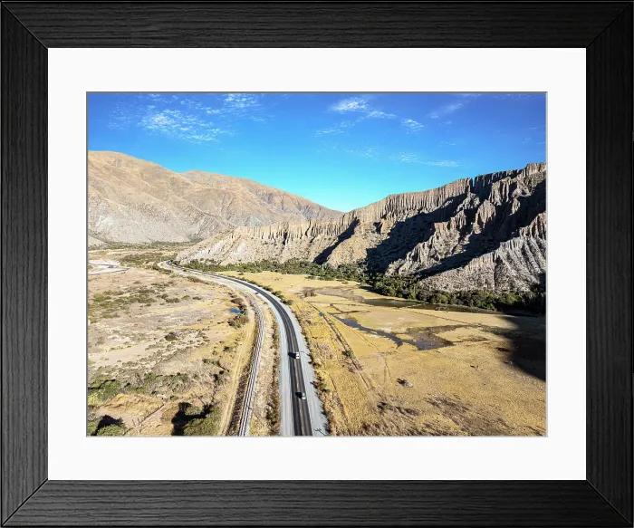 Framed Print : Cars on a road winding through a valley, Tumbaya, Jujuy, Argentina Framed Print : Cars on a road winding through a valley, Tumbaya, Jujuy, Argentina