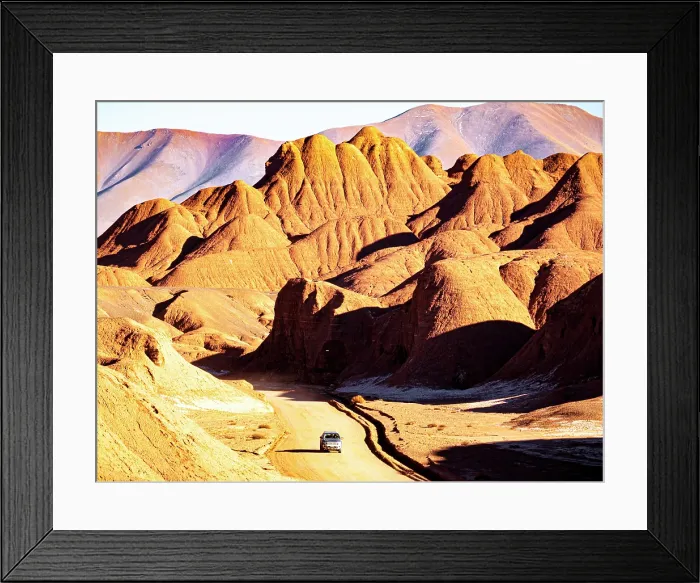 Framed Print : 4x4 on a road through red rock formations, Labyrinth desert, Puna, Salta, Argentina