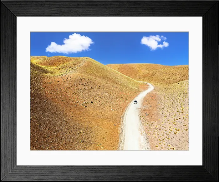 Framed Print : Off-road vehicle among colorful slopes, Vega de los Colorados, Puna, Catamarca, Argentina
