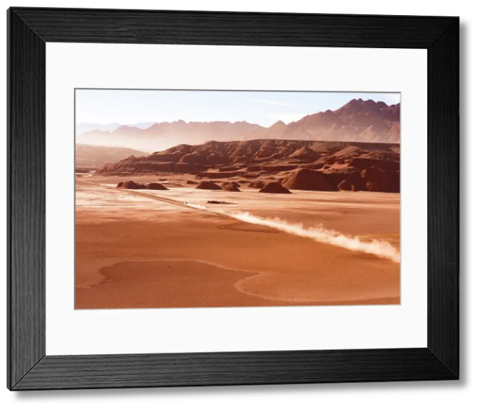 Framed Print : Car driving on a dust track along Desierto del Diablo, Devil's Desert, Puna, Argentina Framed Print : Car driving on a dust track along Desierto del Diablo, Devil's Desert, Puna, Argentina