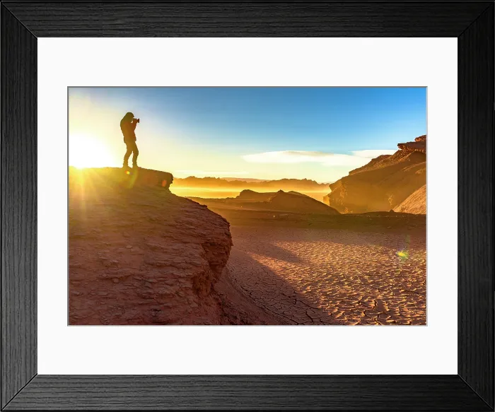 Framed Print : Man photographing the cracked dry soil in the Labyrinth Desert, Puna, Argentina. (MR)