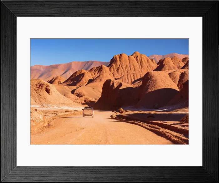Framed Print : Pick-Up traveling on an empty road, Labyrinth Desert, Puna, Argentina