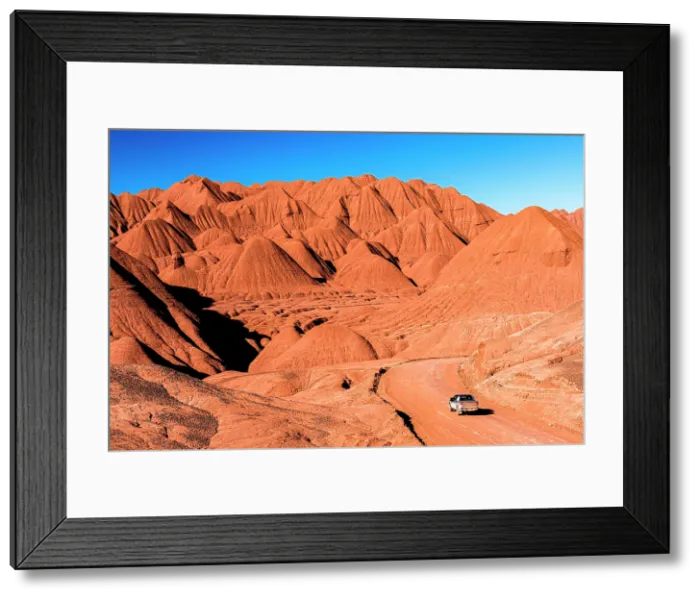 Framed Print : High angle view of a 4x4 driving in the Labyrinth Desert, Puna, Argentina Framed Print : High angle view of a 4x4 driving in the Labyrinth Desert, Puna, Argentina