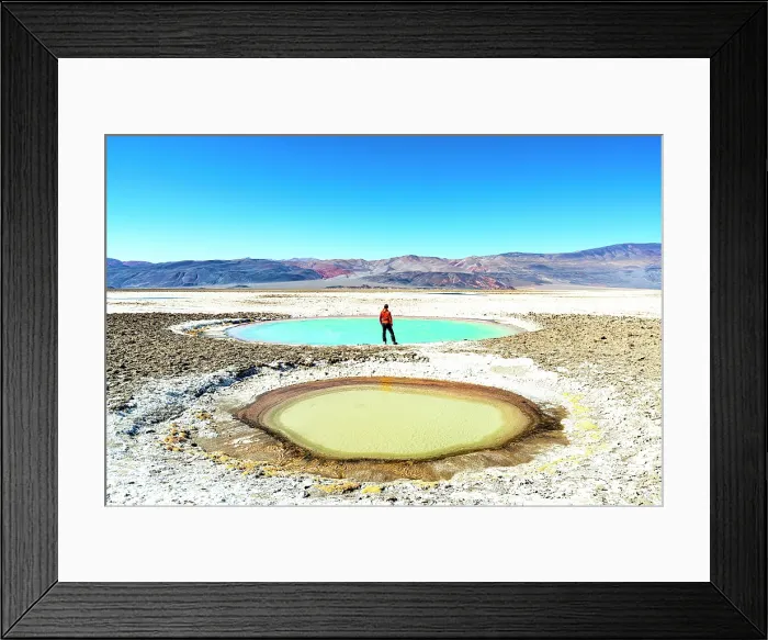 Framed Print : Man looking at colorful lagoons, Ojos del Campo, Salar de Antofalla, Puna, Catamarca, Argentina. (MR)