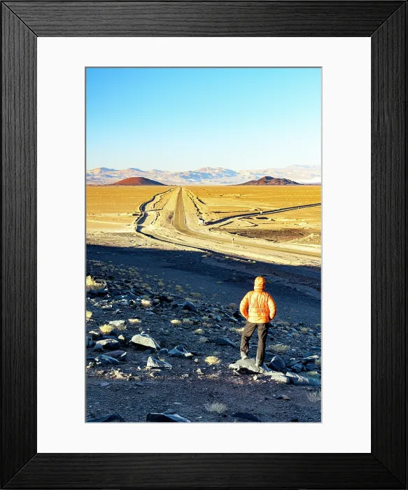 Framed Print : Man looking at a desert road, El Penon, Puna, Catamarca, Argentina. (MR) Framed Print : Man looking at a desert road, El Penon, Puna, Catamarca, Argentina. (MR)