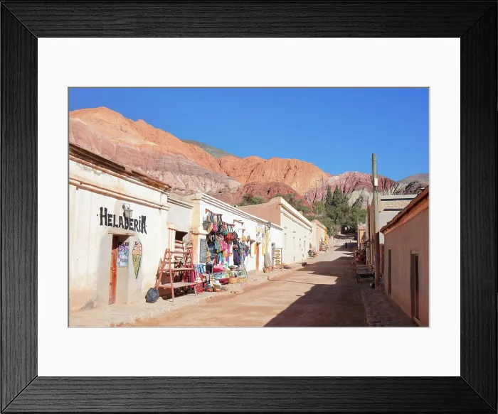Framed Print : A street of the Purmamarca town with the Cerro de los 7 Colores in background (Hill of 7 Colors), Quebrada de Humahuaca, Jujuy, Northwest Argentina Framed Print : A street of the Purmamarca town with the Cerro de los 7 Colores in background (Hill of 7 Colors), Quebrada de Humahuaca, Jujuy, Northwest Argentina