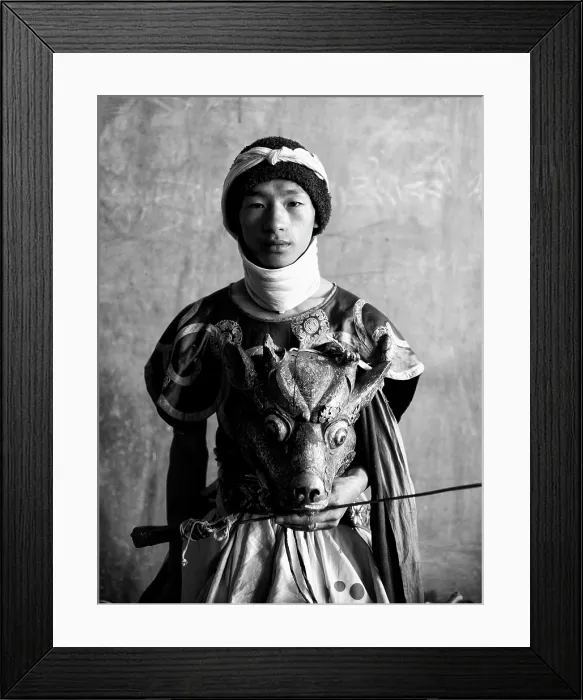 Framed Print : Buddhist monk holding ancient wooden mask and sword during a festival or Tsechu, Gangte Goembe, Bhutan, Asia