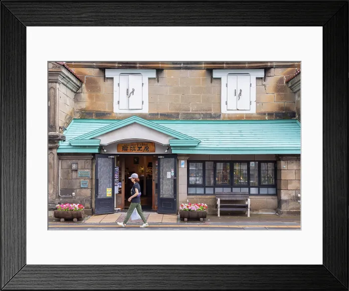Framed Print : Woman walking past old stone store, Otaru, Hokkaido, Japan Framed Print : Woman walking past old stone store, Otaru, Hokkaido, Japan