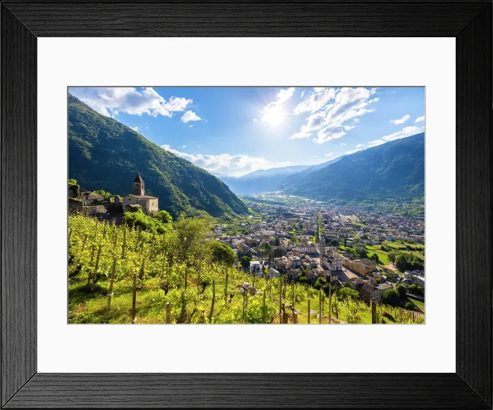 Framed Print : Church of Santa Perpetua dominating the city of Tirano. Tirano, Sondrio district, Valtellina, Lombardy, Italy Framed Print : Church of Santa Perpetua dominating the city of Tirano. Tirano, Sondrio district, Valtellina, Lombardy, Italy