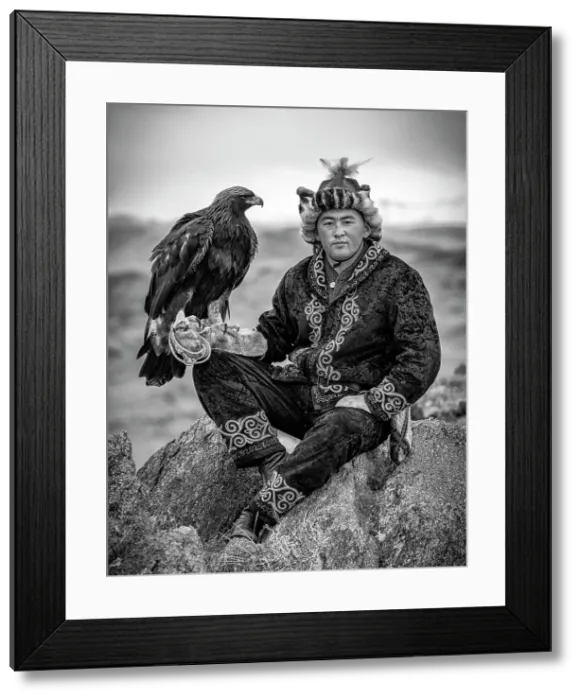 Framed Print : Young Kazakh Eagle Hunter posing with his Golden Eagle, Altai Mountains, Western Mongolia, Asia Framed Print : Young Kazakh Eagle Hunter posing with his Golden Eagle, Altai Mountains, Western Mongolia, Asia