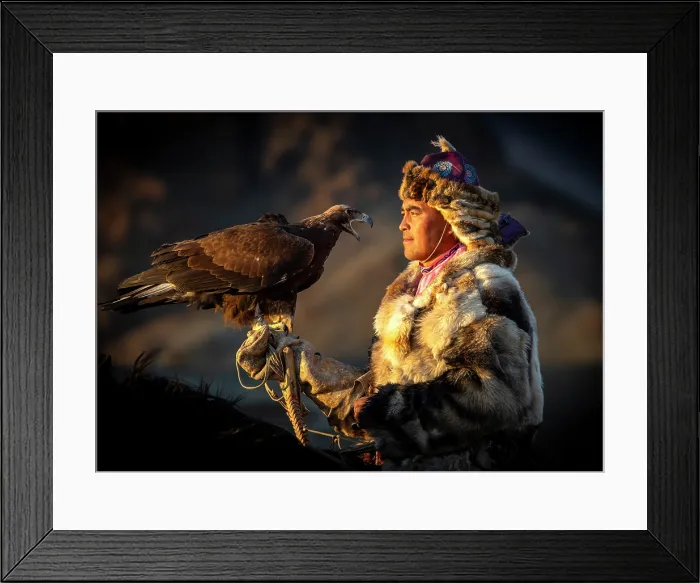 Framed Print : Kazakh Eagle Hunter on horseback wearing traditional fur clothing and posing with his trained golden eagle, Bayan-Ulgii Province, Western Mongolia Framed Print : Kazakh Eagle Hunter on horseback wearing traditional fur clothing and posing with his trained golden eagle, Bayan-Ulgii Province, Western Mongolia