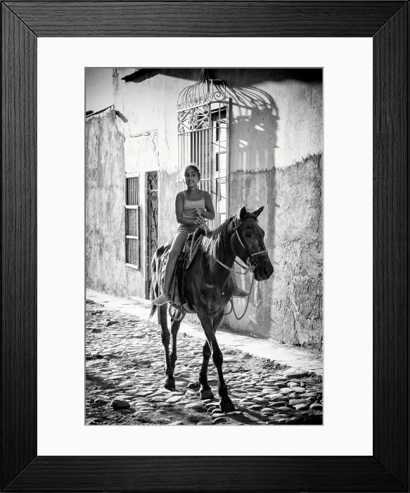 Framed Print : Young Cuban girl riding her horse on a cobbled street in the old sugar town of Trinidad (a UNESCO World Heritage Site) Cuba, Caribbean Framed Print : Young Cuban girl riding her horse on a cobbled street in the old sugar town of Trinidad (a UNESCO World Heritage Site) Cuba, Caribbean