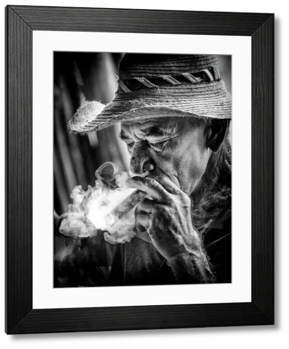 Framed Print : Portrait of a tobacco farmer, smoking. a cigar, Vinales Valley, Pinar del Rio Province, Cuba, Caribbean Framed Print : Portrait of a tobacco farmer, smoking. a cigar, Vinales Valley, Pinar del Rio Province, Cuba, Caribbean