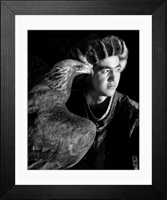 Framed Print : Black & white portrait of a young Kazakh Eagle Hunter posing with his trained golden eagle, Bayan-Ulgii Province, Western Mongolia, Asia Framed Print : Black & white portrait of a young Kazakh Eagle Hunter posing with his trained golden eagle, Bayan-Ulgii Province, Western Mongolia, Asia