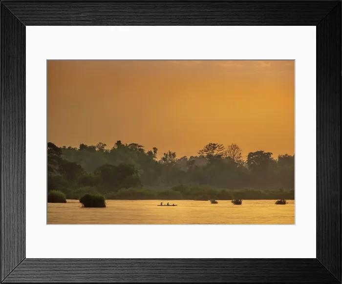 Framed Print : Laos, Champasak Province, Si Phan Don (4000 islands), Mekong river, sunset view of fishermen on the river. Forest silhouetted behind, orange glow in the sky and water Framed Print : Laos, Champasak Province, Si Phan Don (4000 islands), Mekong river, sunset view of fishermen on the river. Forest silhouetted behind, orange glow in the sky and water