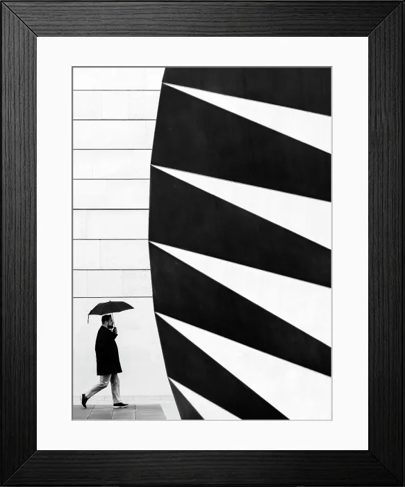 Framed Print : Man with umbrella walking past the Angel's Wings air vent in Paternoster Square, London, England Framed Print : Man with umbrella walking past the Angel's Wings air vent in Paternoster Square, London, England