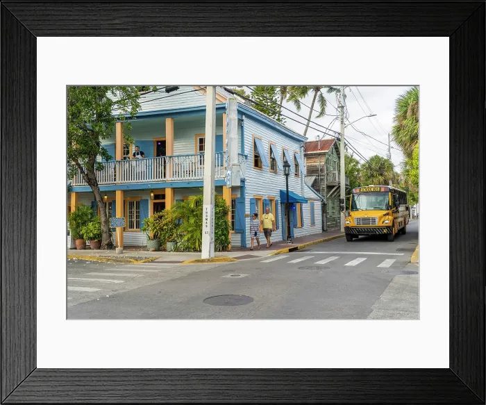 Framed Print : School bus passing a colourful building, Key West, Florida, USA Framed Print : School bus passing a colourful building, Key West, Florida, USA