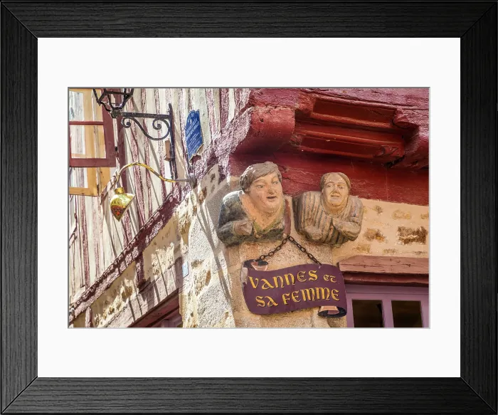 Framed Print : Funny figures on a half-timbered house in the old town of Vannes, Morbihan, Brittany, France Framed Print : Funny figures on a half-timbered house in the old town of Vannes, Morbihan, Brittany, France
