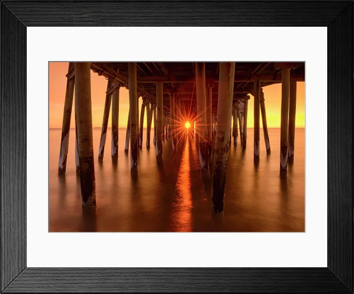 Framed Print : Sun rising through Old Orchard Beach pier, Old Orchard, Maine, USA Framed Print : Sun rising through Old Orchard Beach pier, Old Orchard, Maine, USA