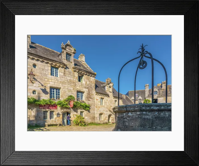 Framed Print : Historic granite stone houses at Place de l'Eglise in Locronan, Finistere, Brittany, France