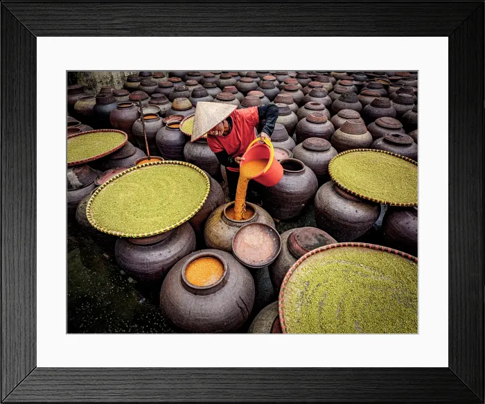 Framed Print : Woman with conical hat pouring soy sauce into traditional jars, Hanoi, Vietnam. (MR) Framed Print : Woman with conical hat pouring soy sauce into traditional jars, Hanoi, Vietnam. (MR)