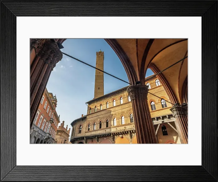 Framed Print : europe, Italy, Emilia-Romagna, Bologna. A road in the historic centre with the typical porticoes and the asinelli tower. Piazza della Mercanzia Framed Print : europe, Italy, Emilia-Romagna, Bologna. A road in the historic centre with the typical porticoes and the asinelli tower. Piazza della Mercanzia