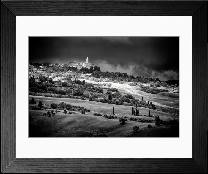 Framed Print : View across the Val d'Orcia towards Pienza beneath a dark, stormy sky, Tuscany, Italy Framed Print : View across the Val d'Orcia towards Pienza beneath a dark, stormy sky, Tuscany, Italy