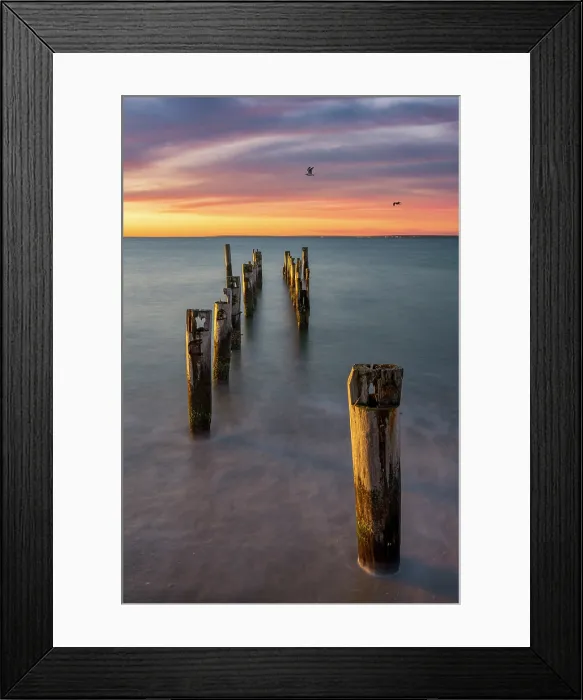 Framed Print : Pier pillars at sunrise at beach on Cape Cod, East Falmouth, Massachusetts, USA Framed Print : Pier pillars at sunrise at beach on Cape Cod, East Falmouth, Massachusetts, USA