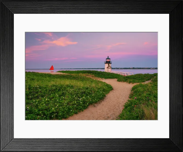 Framed Print : Sunset over Brant Point Lighthouse with red sailboat on Nantucket Island, Massachusetts, USA Framed Print : Sunset over Brant Point Lighthouse with red sailboat on Nantucket Island, Massachusetts, USA