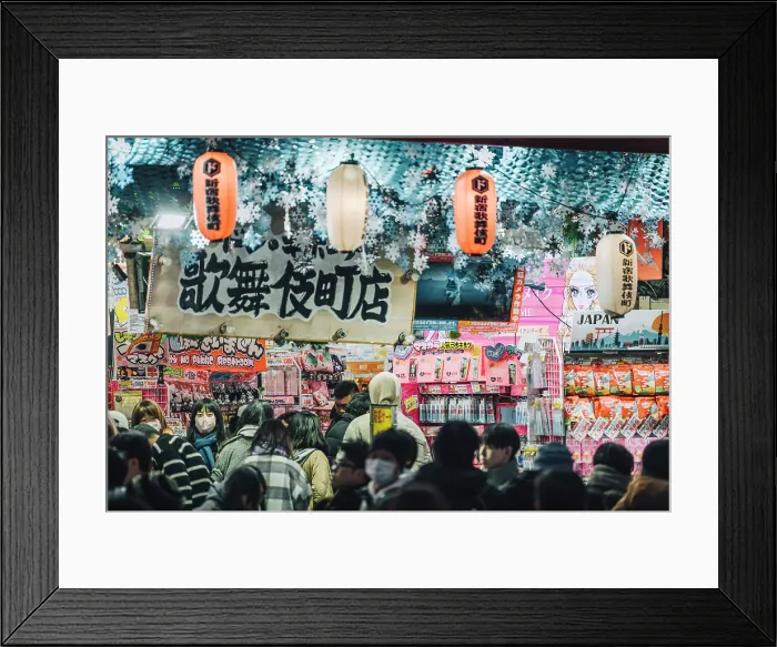 Framed Print : Japan, Tokyo, Shoppers browse goods in a busy shop in Kabukicho district Framed Print : Japan, Tokyo, Shoppers browse goods in a busy shop in Kabukicho district
