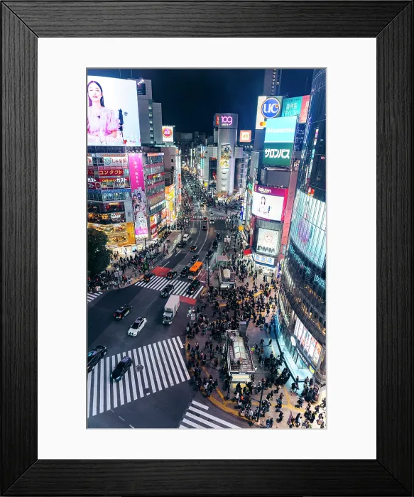 Framed Print : Crowds cross Shibuya Crossing, Tokyo, at night, illuminated by bright billboards Framed Print : Crowds cross Shibuya Crossing, Tokyo, at night, illuminated by bright billboards