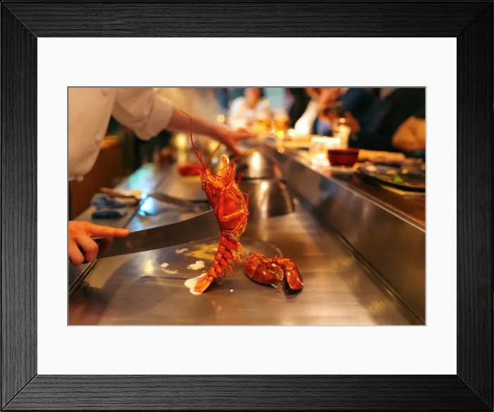 Framed Print : Chef prepares lobster teppanyaki for diners in Tokyo, Japan
